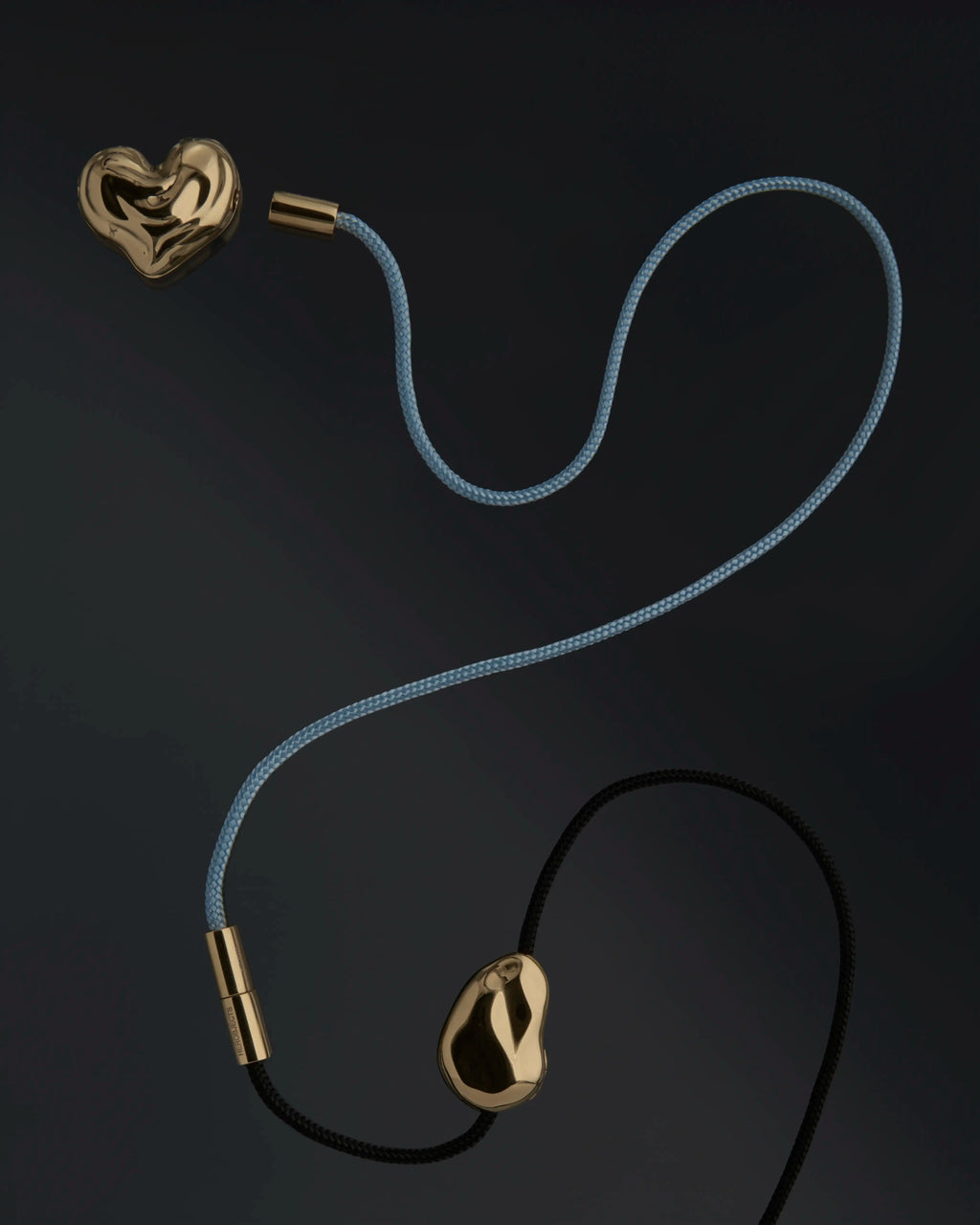 18K gold blue and black cord necklaces with heart and pomegranate seed pendants